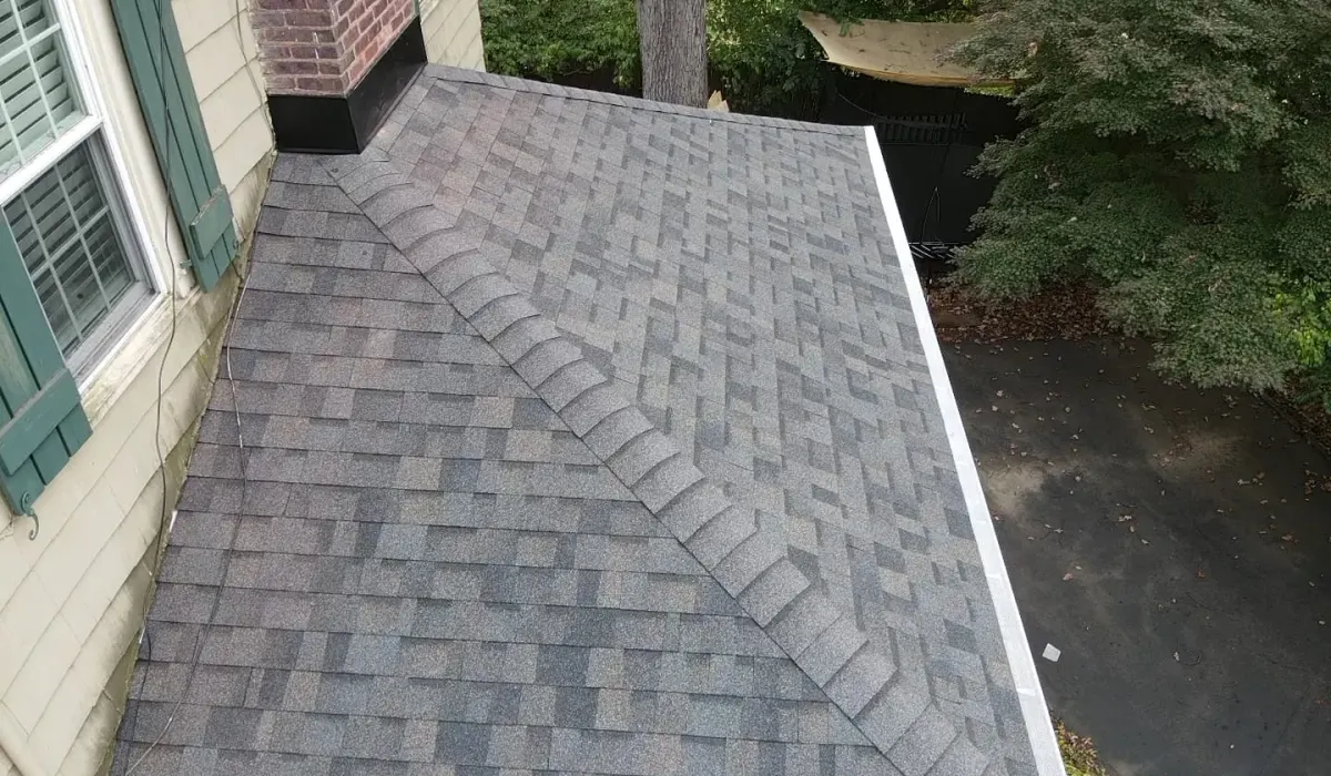 A freshly installed section of architectural asphalt shingles on a New Jersey home after a roof repair